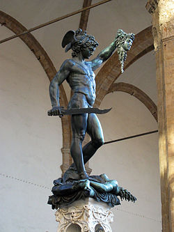 Perseus beheading Medusa, a hideous woman-faced Gorgon whose hair had been turned to snakes; anyone who looked at her was turned to stone. Perseus stands naked except for a sash and winged sandals, triumphant on top of the body of Medusa with her head, crowned with writhing snakes, in his raised hand. Blood spews from Medusa's severed neck.